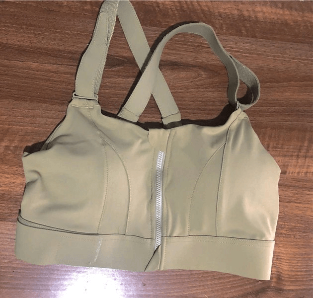 Stylish Women's Shockproof Sports Bra with Adjustable Fastening, beige, ideal for fitness, lightweight poly-spandex fabric.